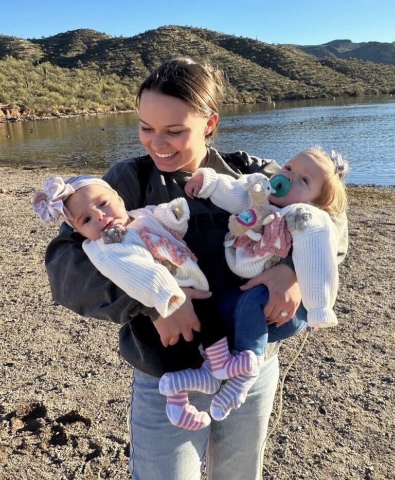 portrait of a mother with twins in front of a lake